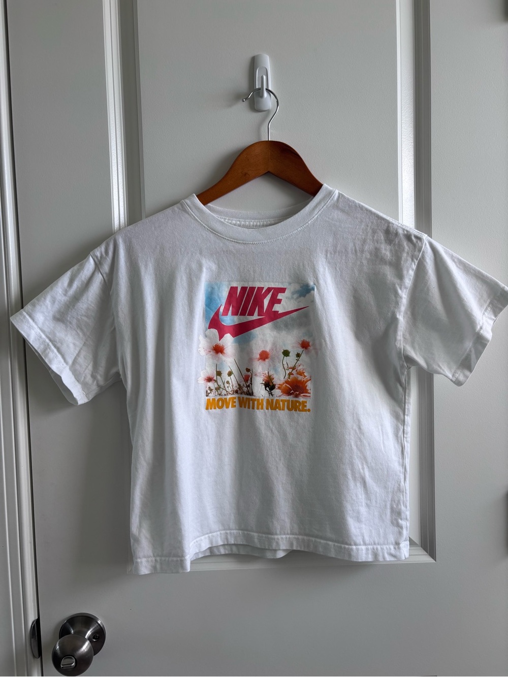 Nike White Kids' Graphic Tee with Pink Logo and Orange Floral Print